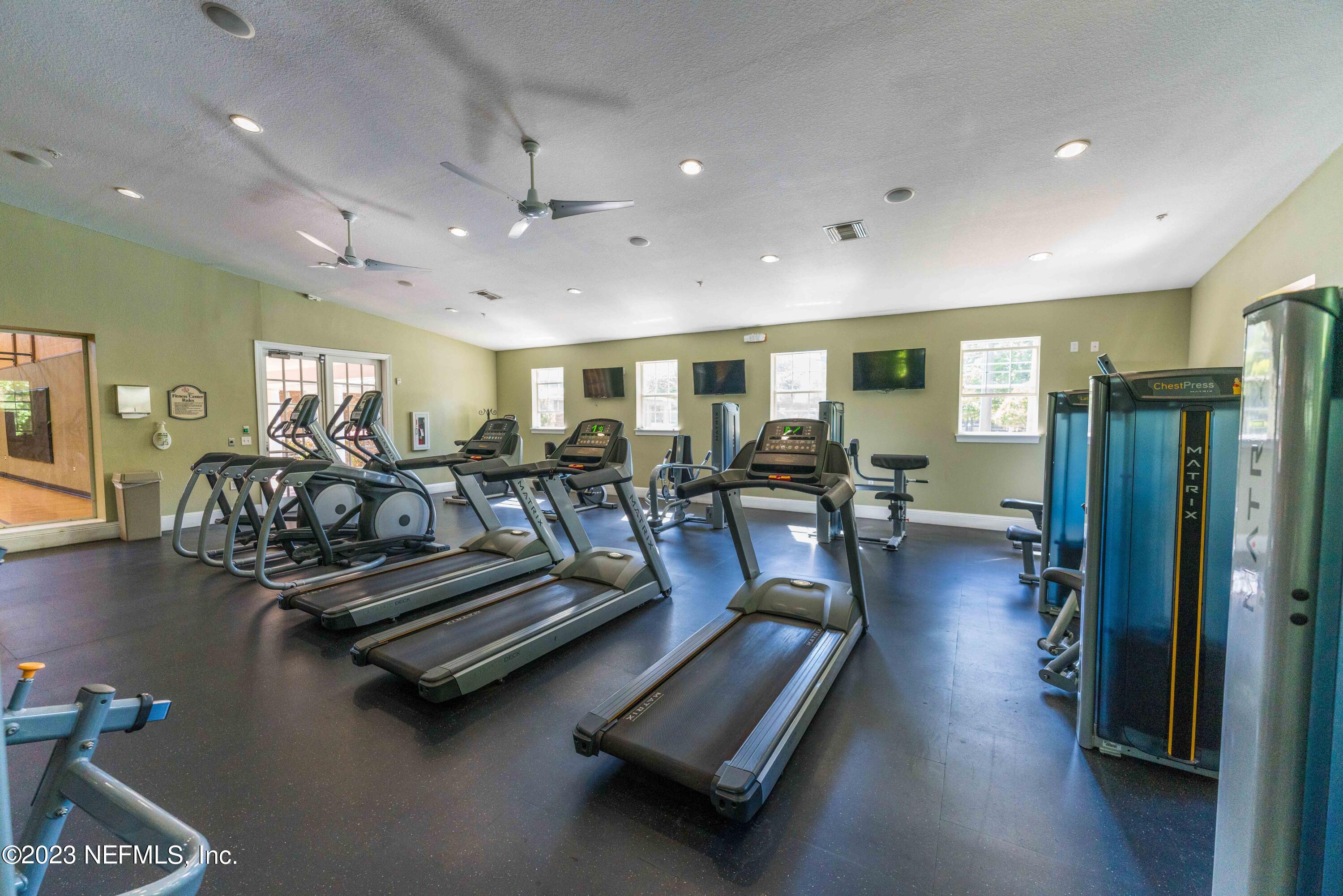 8550 Touchton Road, Unit 1136 Jacksonville, FL 32216 - Photo 50 of 53 a living room with furniture pool table and a flat screen tv