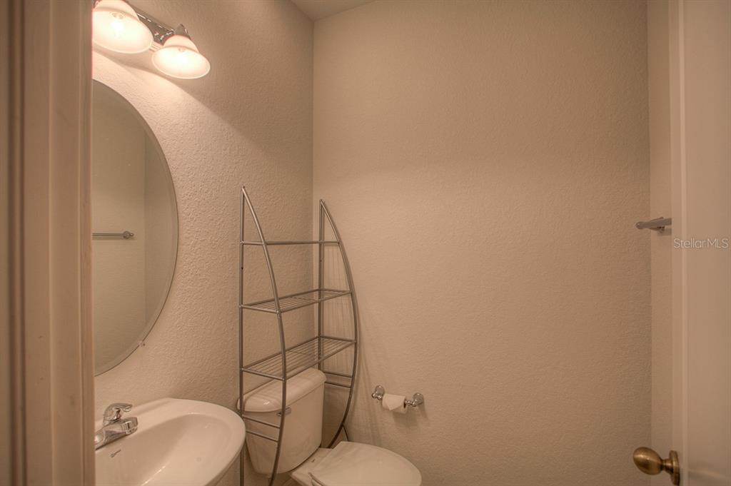 6021 Printery Street, Unit 106 Tampa, FL 33616 - Photo 13 of 23 a bathroom with a toilet and a sink
