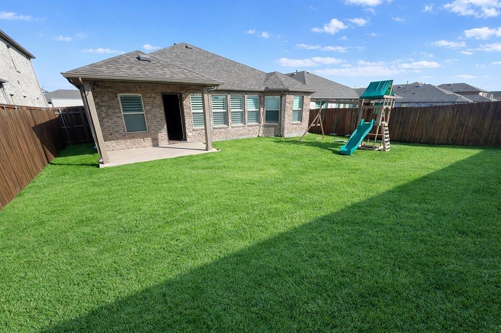 6609 Adderly Road Pilot Point, TX 76258 - Photo 15 of 15 a front view of a house with garden