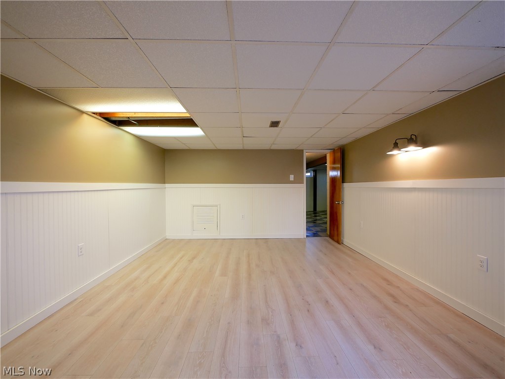57500 Hospital Road Bellaire, OH 43906 - Photo 18 of 22 Basement with light hardwood / wood-style floors and a drop ceiling