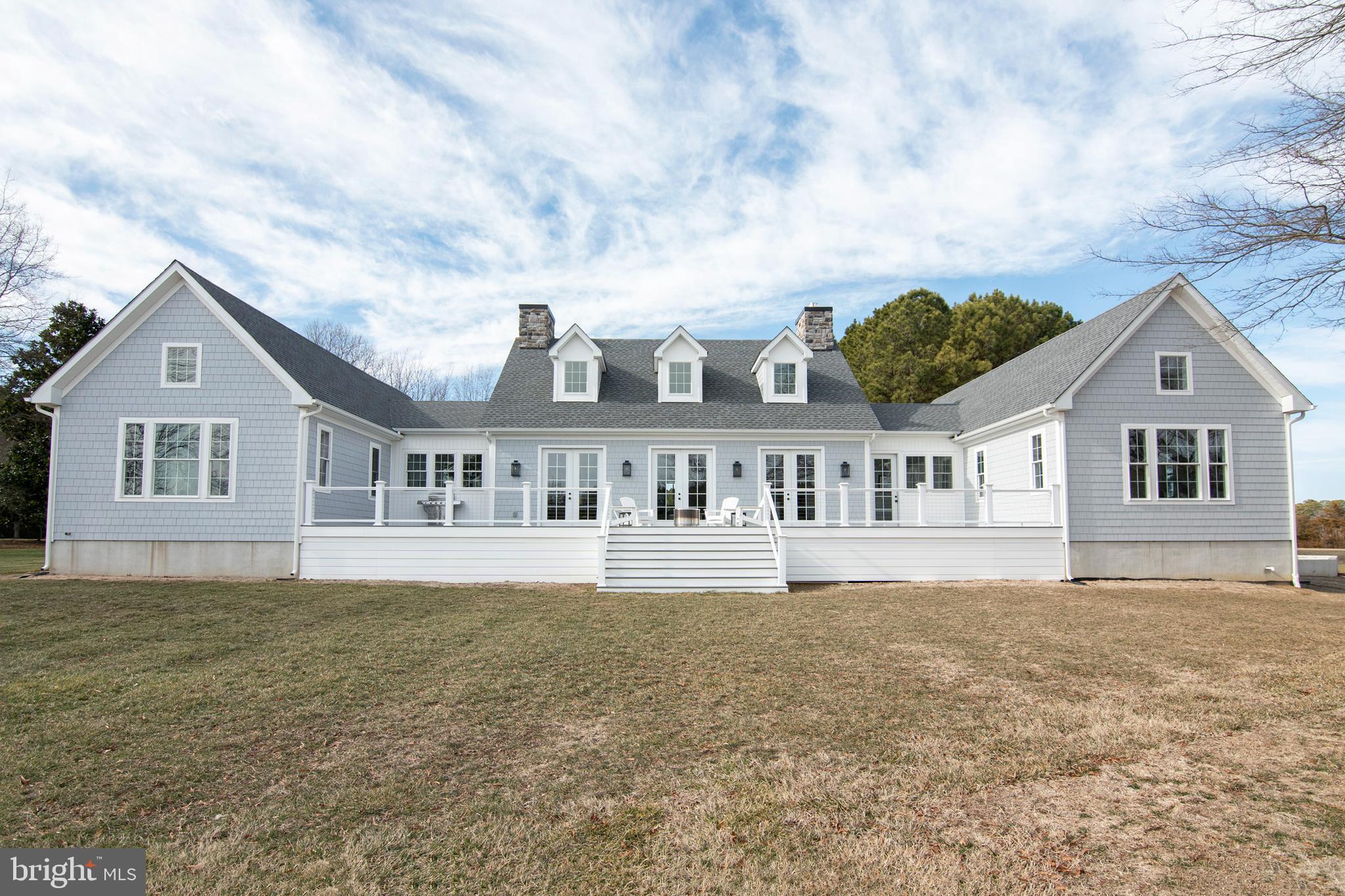 21825 Langdon Farm Road Sherwood, MD 21665 - Photo 15 of 47 a front view of a house with a garden and yard