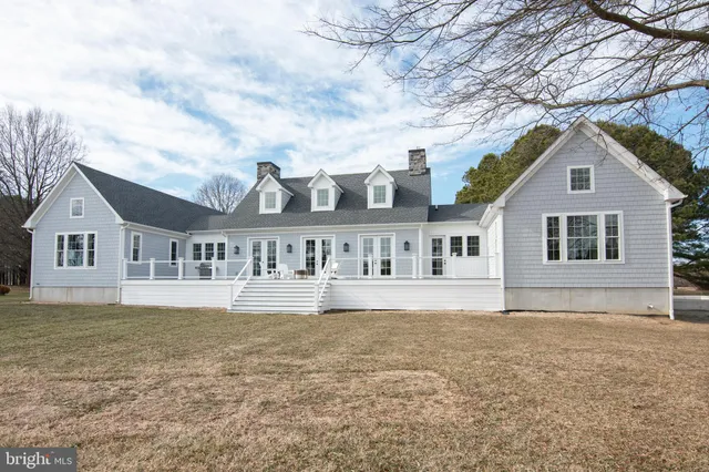 front view of a house with a swimming pool