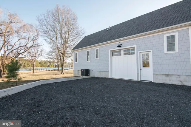 a view of a patio with table and chairs and wooden floor