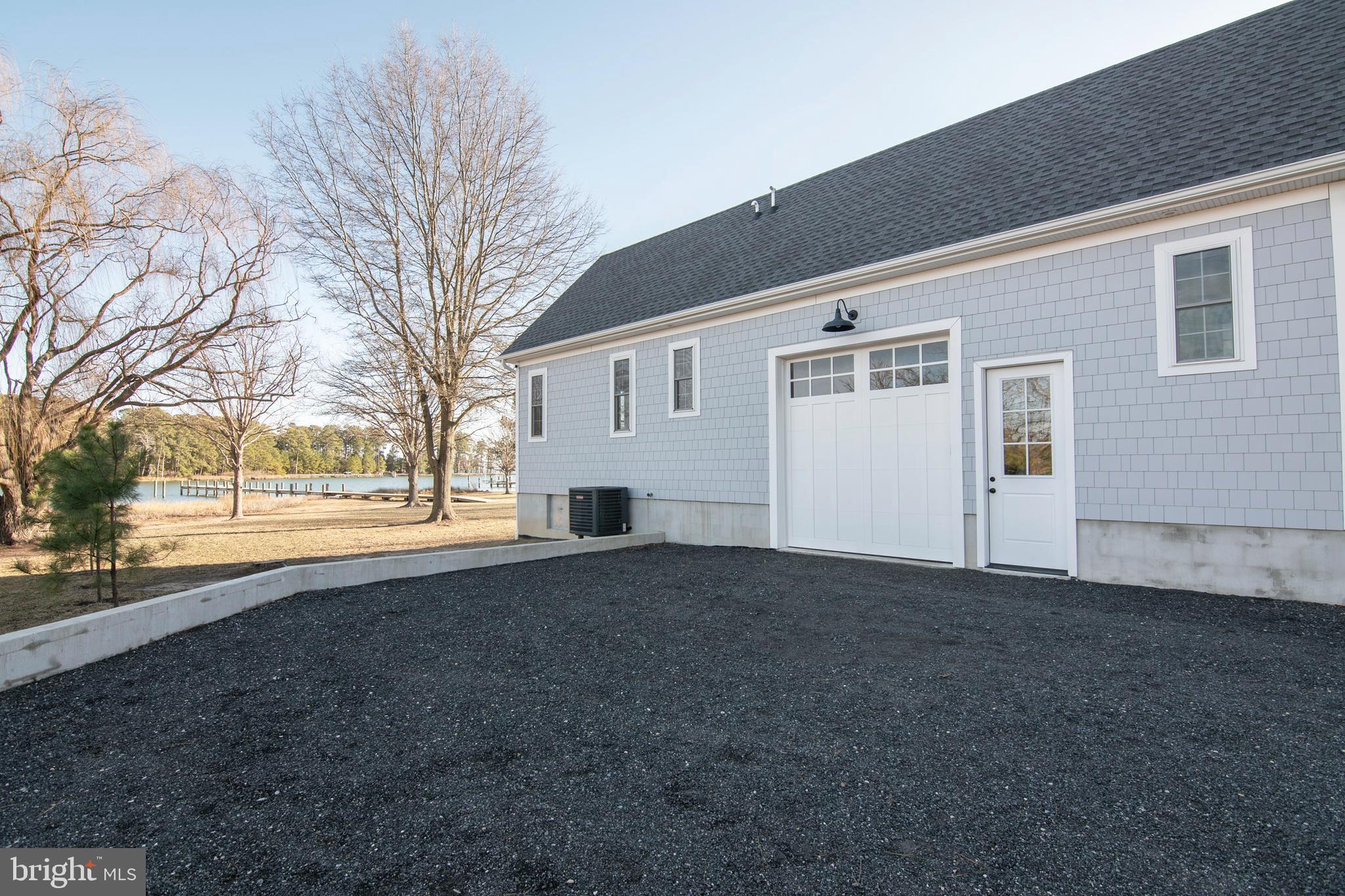 21825 Langdon Farm Road Sherwood, MD 21665 - Photo 18 of 47 a view of a house with a yard