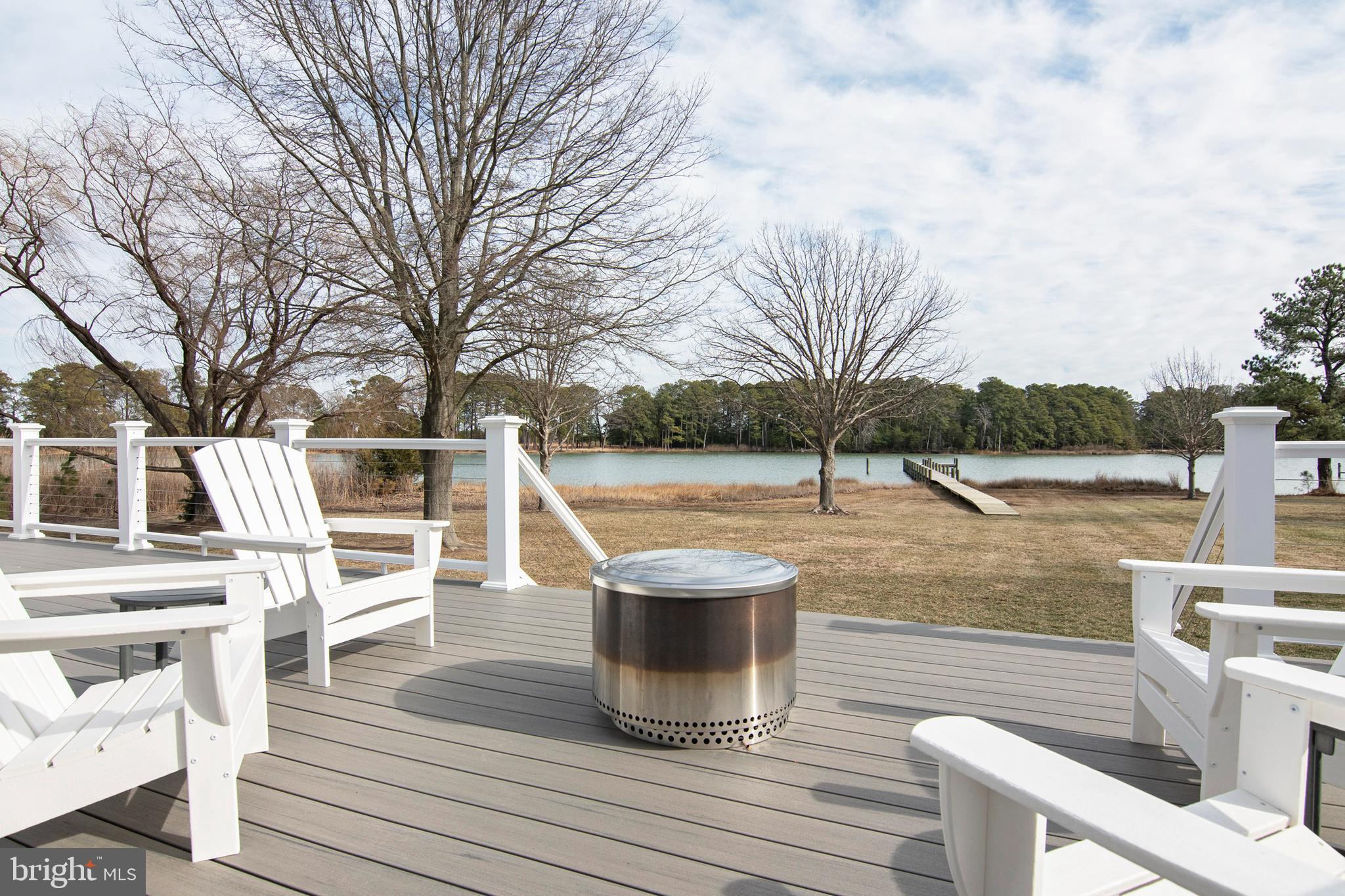 21825 Langdon Farm Road Sherwood, MD 21665 - Photo 22 of 47 a view of a patio with chairs next to a yard