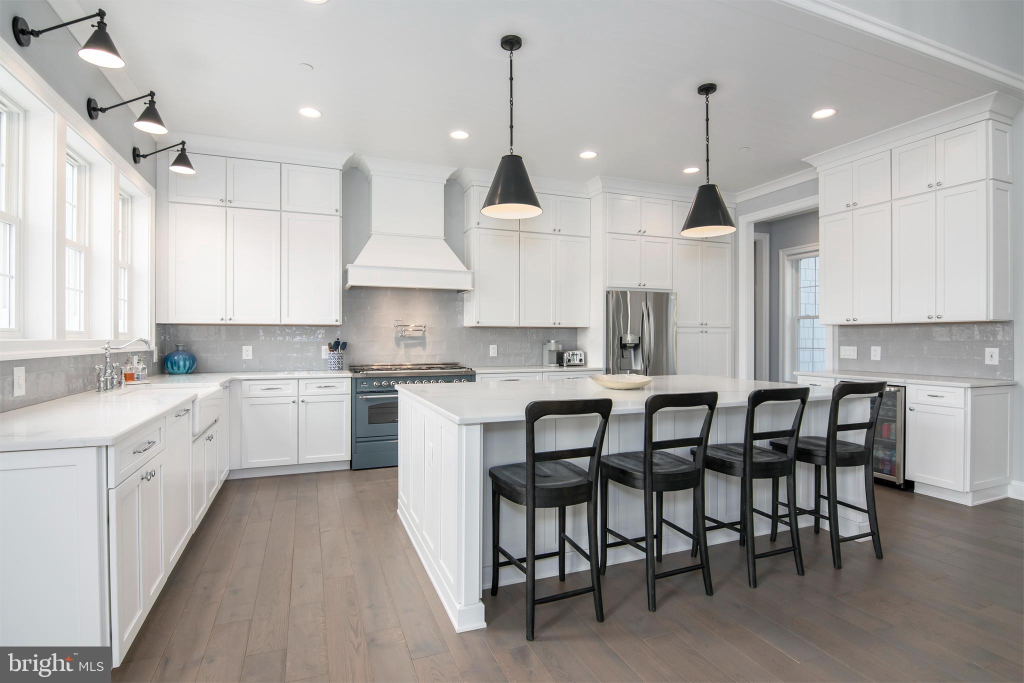 21825 Langdon Farm Road Sherwood, MD 21665 - Photo 24 of 47 a kitchen with granite countertop white cabinets stainless steel appliances and window