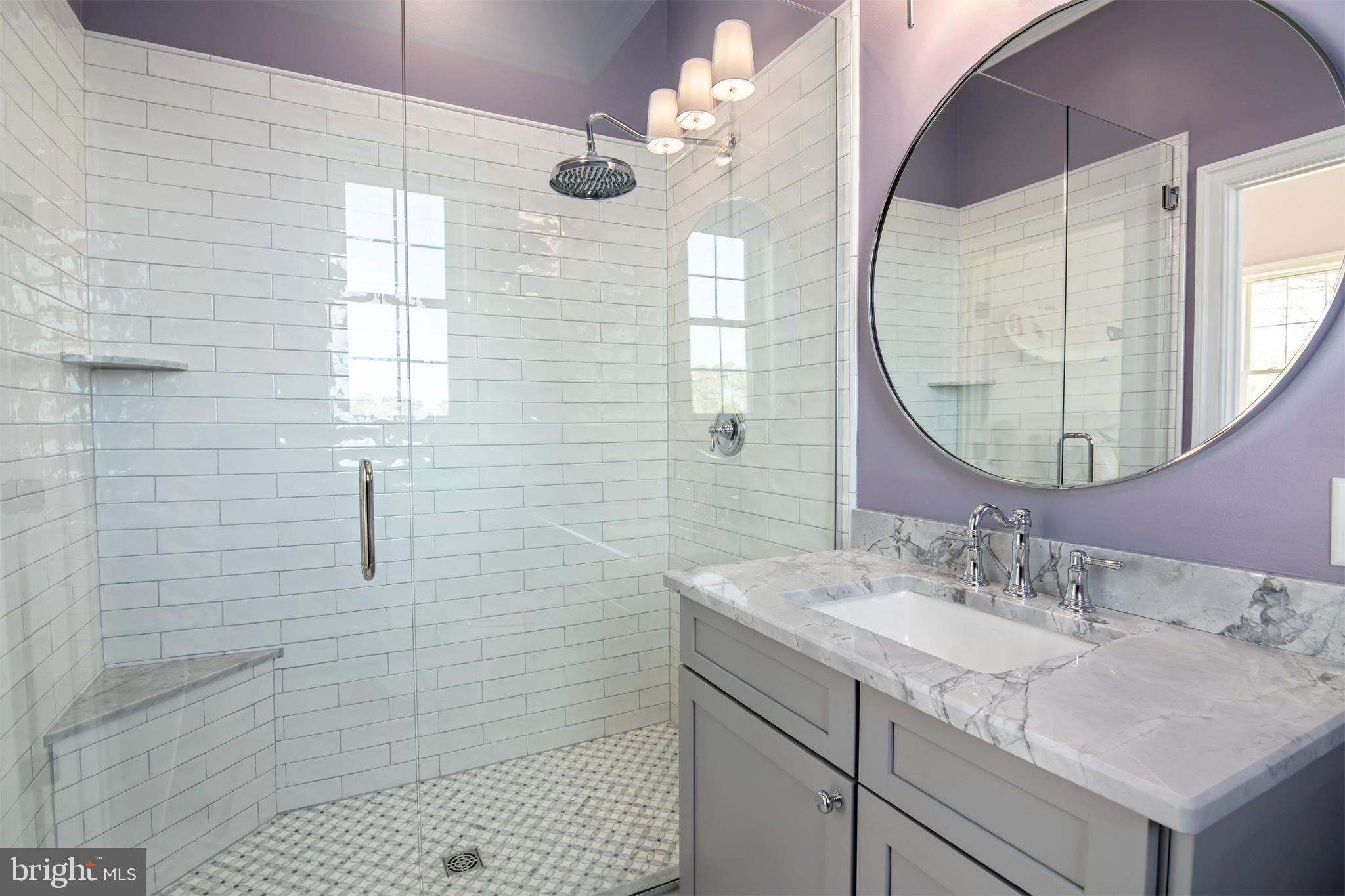 21825 Langdon Farm Road Sherwood, MD 21665 - Photo 36 of 47 a bathroom with a sink vanity granite and a mirror
