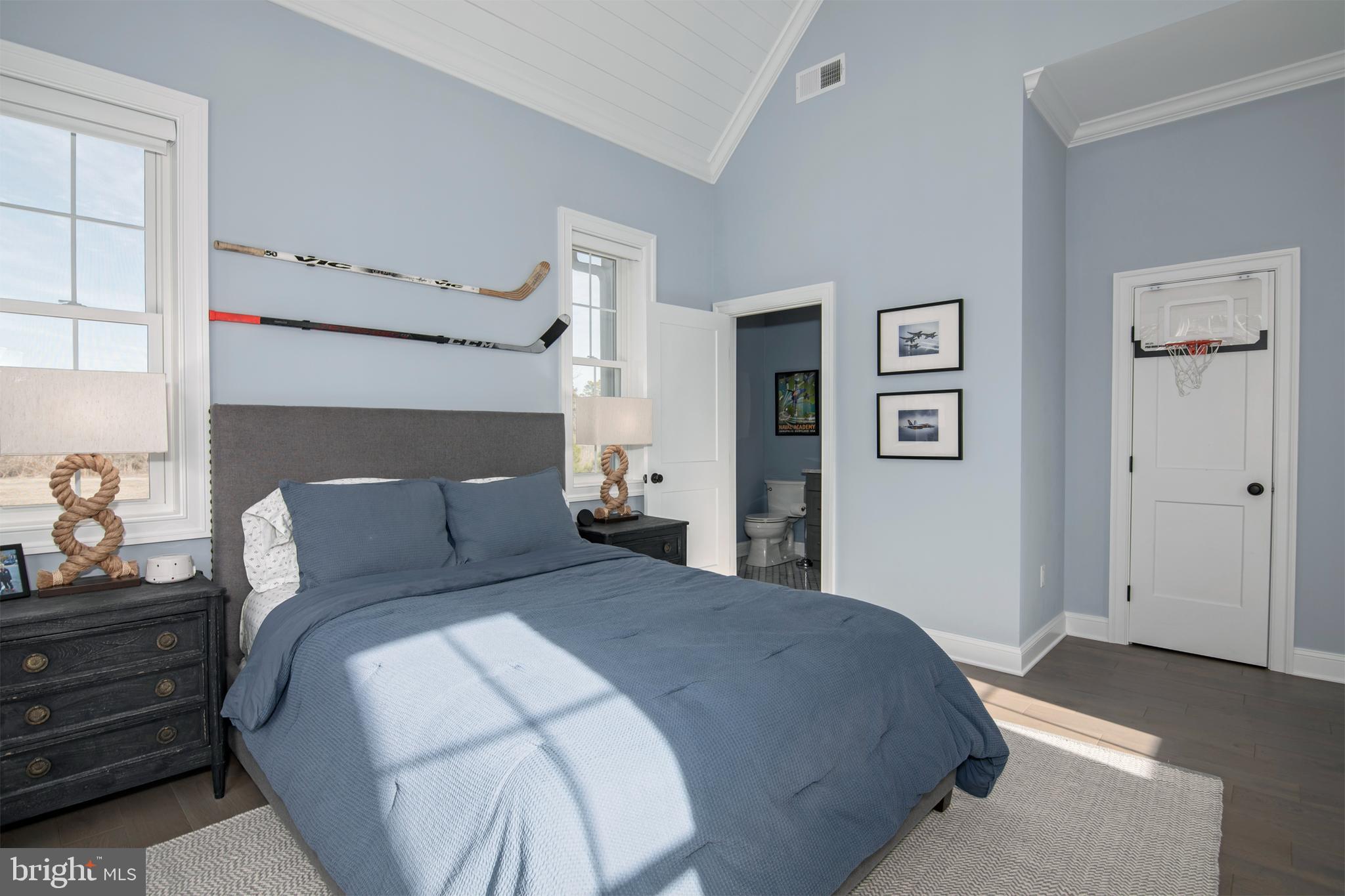 21825 Langdon Farm Road Sherwood, MD 21665 - Photo 38 of 47 a bedroom with a bed and painting on the wall