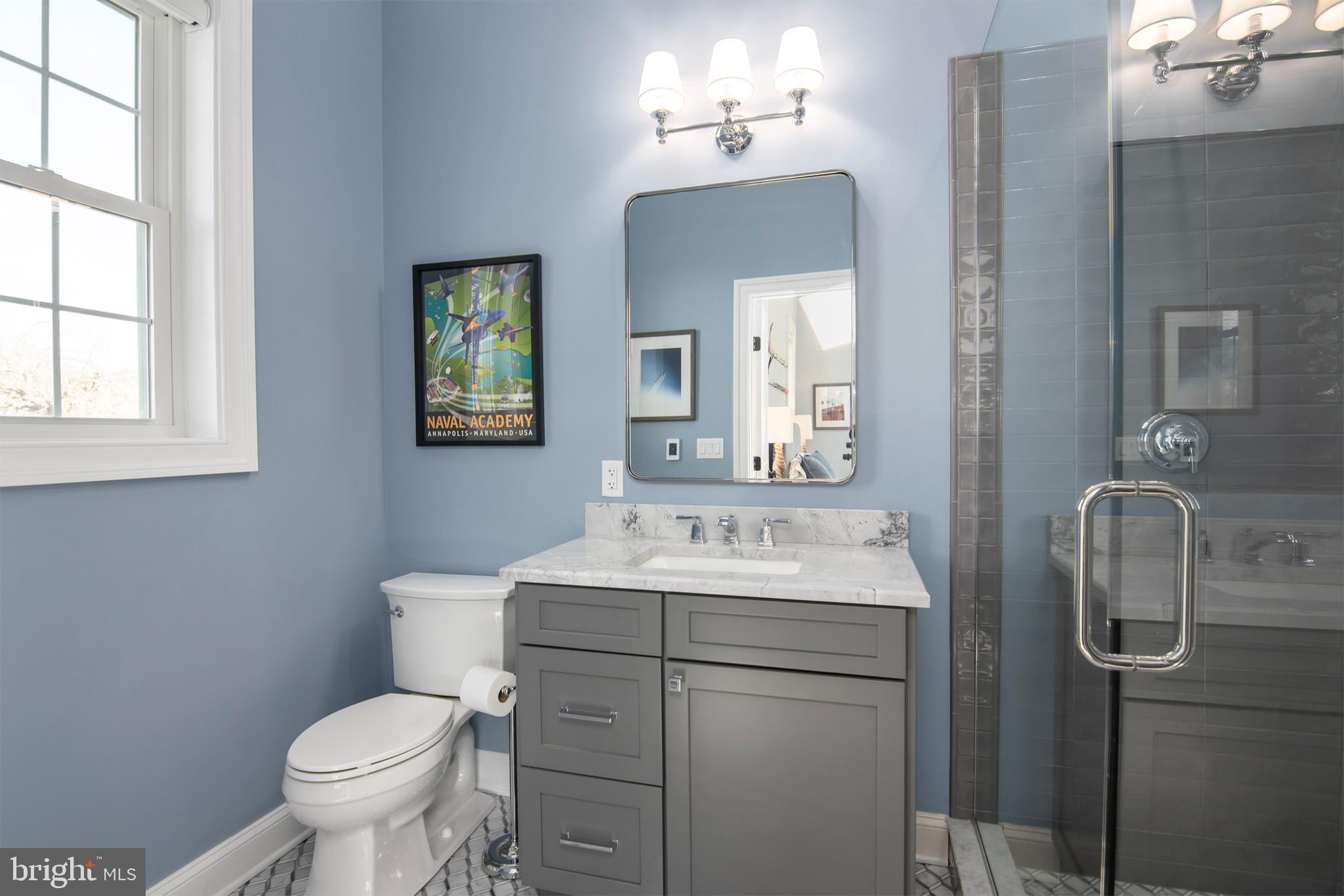 21825 Langdon Farm Road Sherwood, MD 21665 - Photo 39 of 47 a bathroom with a toilet sink and mirror