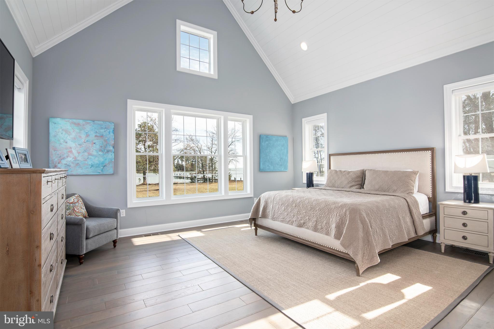 21825 Langdon Farm Road Sherwood, MD 21665 - Photo 40 of 47 a spacious bedroom with a bed couch and a window