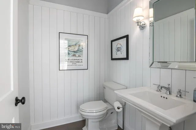 a utility room with sink dryer and washer