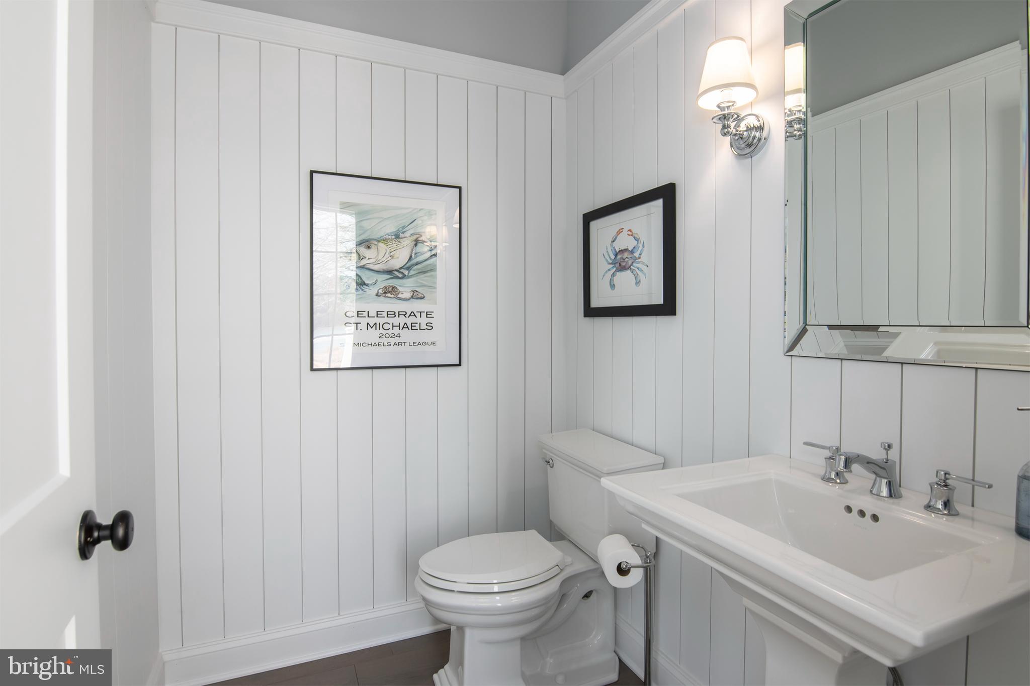 21825 Langdon Farm Road Sherwood, MD 21665 - Photo 45 of 47 a bathroom with a toilet sink and mirror