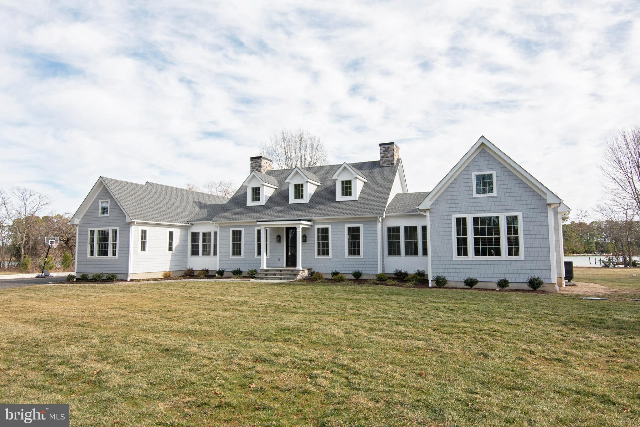 21825 Langdon Farm Road Sherwood, MD 21665 - Photo 7 of 47 a front view of a house with a garden