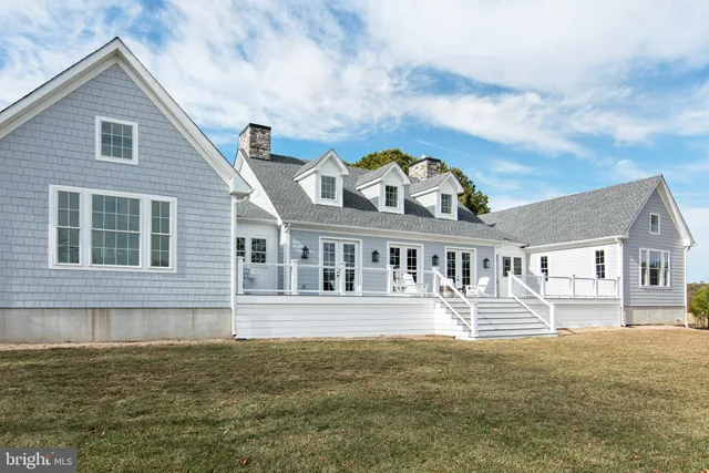 a front view of a house with a ocean view