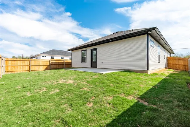 a view of a backyard with a garden