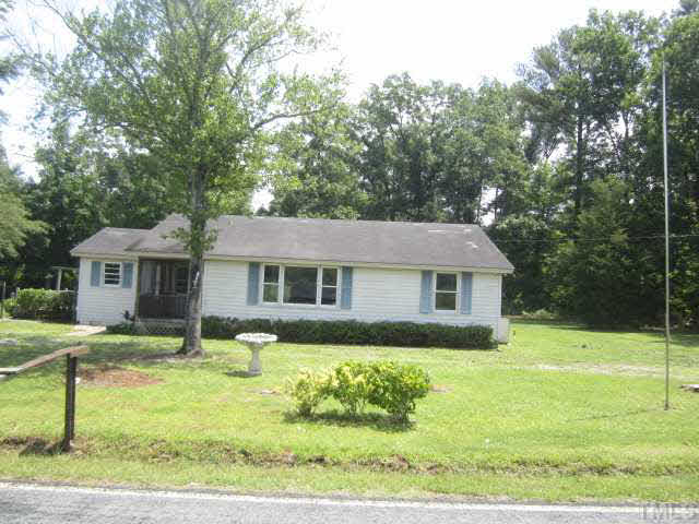 525 Devils Racetrack Road Four Oaks, NC 27524 - Photo 1 of 11 a front view of a house with garden