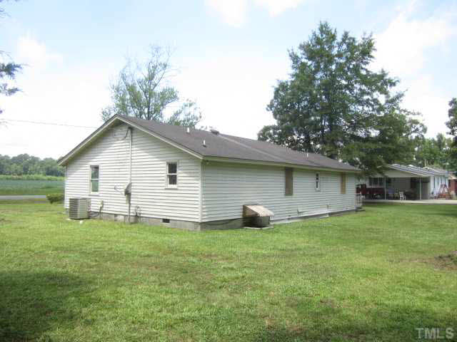 525 Devils Racetrack Road Four Oaks, NC 27524 - Photo 2 of 11 a house that has a tree in front of it