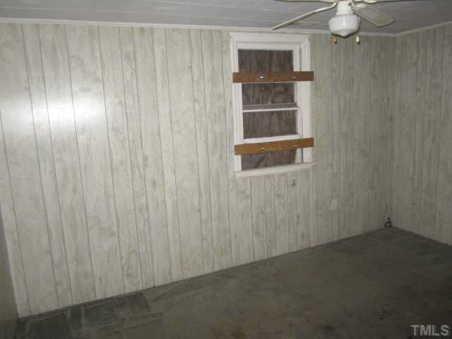 525 Devils Racetrack Road Four Oaks, NC 27524 - Photo 6 of 11 a view of an empty room with a window