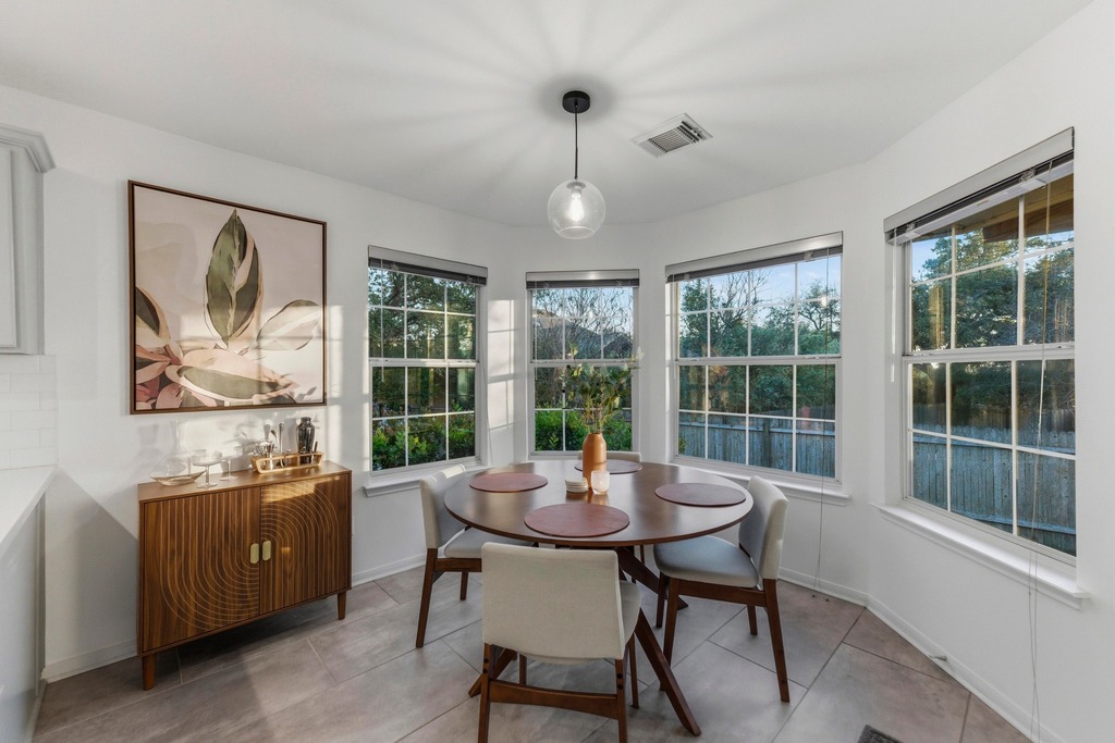 6925 Auckland Drive Austin, TX 78749 - Photo 11 of 29 The Breakfast area is bathed in light creating the perfect setting for entertaining, or for cozy meals at home.