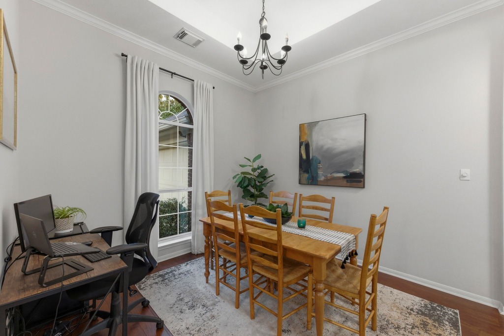 6925 Auckland Drive Austin, TX 78749 - Photo 14 of 29 Perfect for casual meals or hosting friends, the dining space connects seamlessly to the heart of the home.