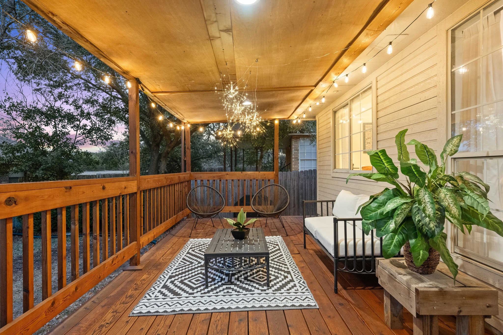 6925 Auckland Drive Austin, TX 78749 - Photo 23 of 29 A south-facing covered patio extends the living space outdoors, ideal for shaded summer evenings and relaxed gatherings.
