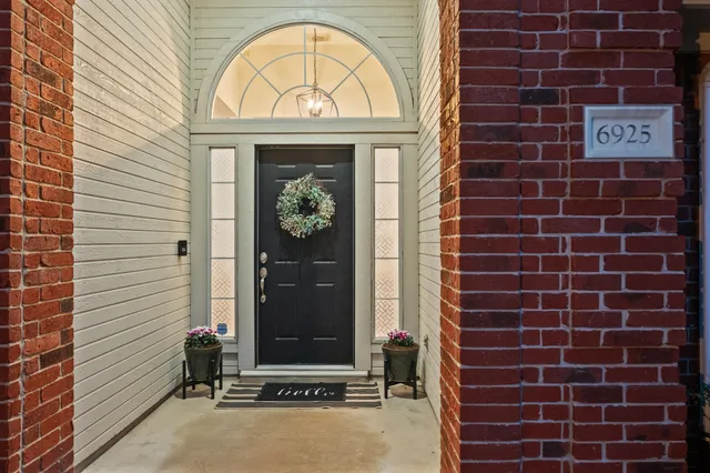 a view of door with wooden door