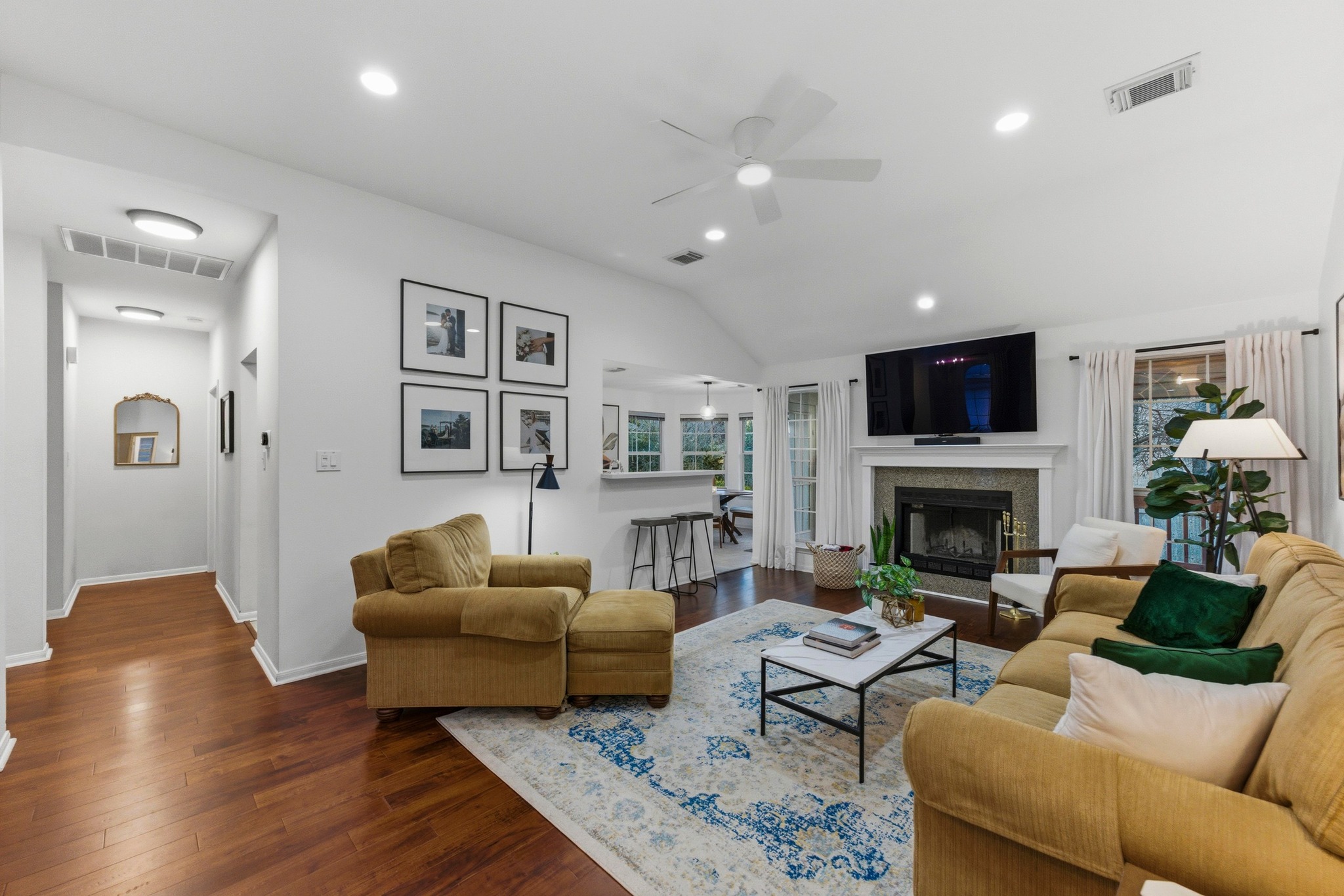 6925 Auckland Drive Austin, TX 78749 - Photo 5 of 29 Light-filled and inviting, this main living space offers an easy, comfortable place to gather, relax, and settle into everyday life.