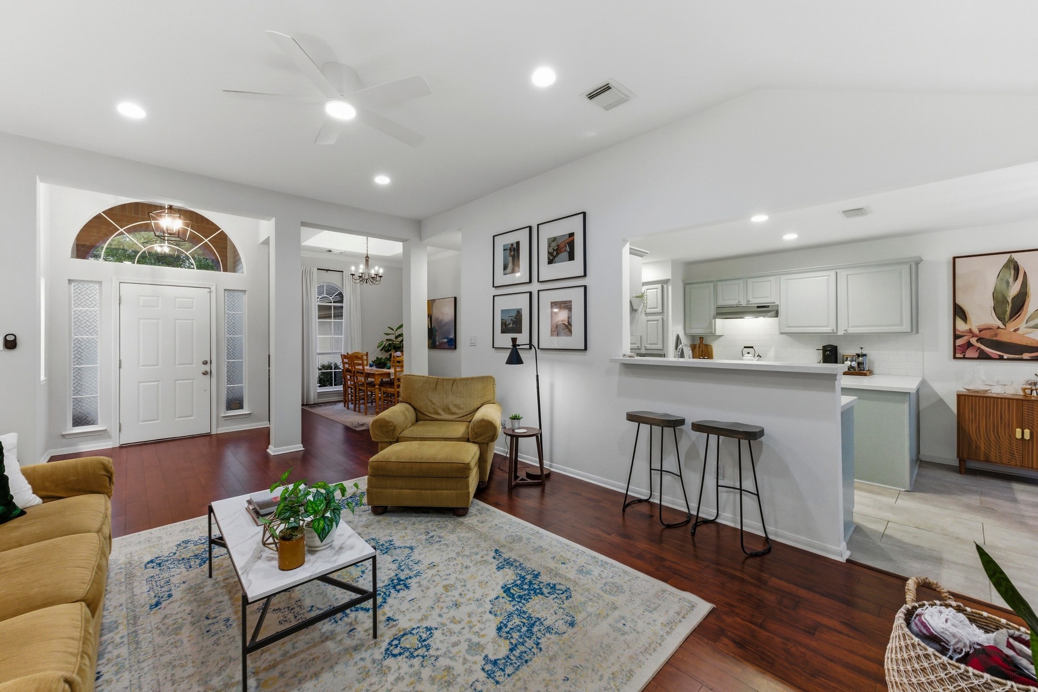 6925 Auckland Drive Austin, TX 78749 - Photo 7 of 29 Open sightlines and natural light create a calm, effortless flow that makes the home feel both functional and warm.
