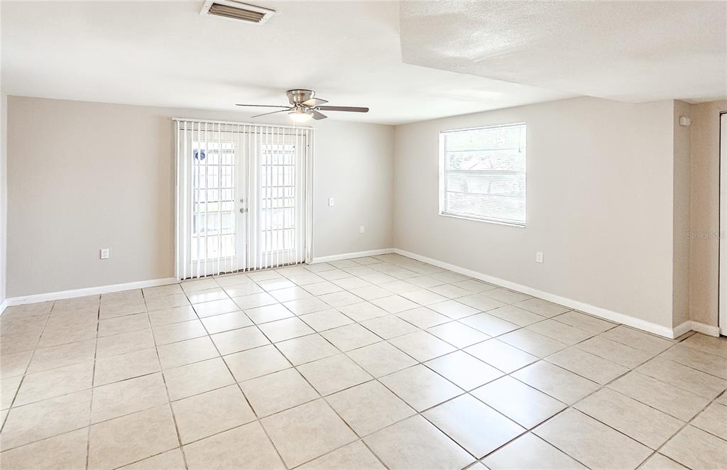 7304 Embassy Boulevard Port Richey, FL 34668 - Photo 9 of 14 a view of an empty room with a window