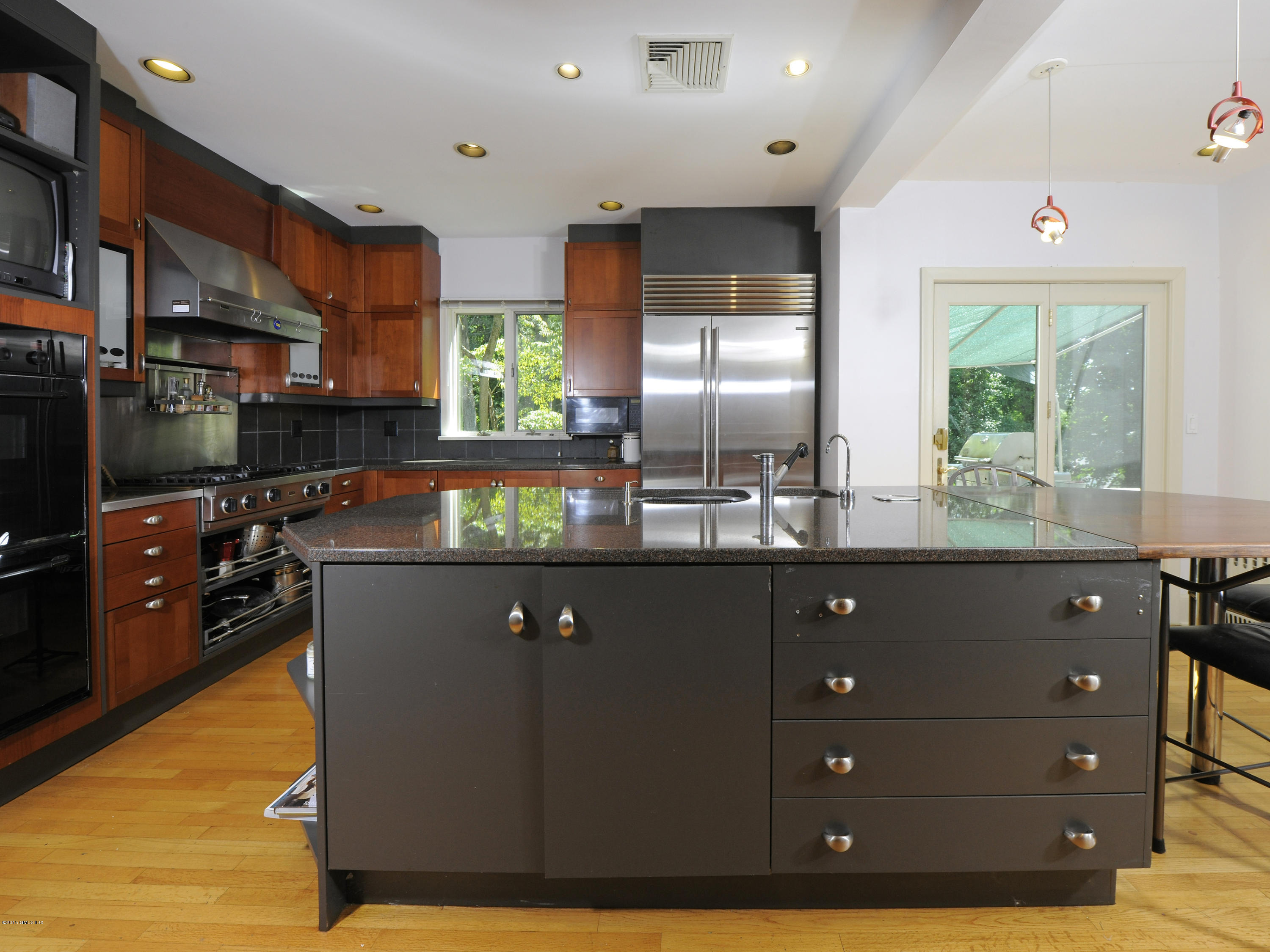 65 Overlook Drive Greenwich, CT 06830 - Photo 12 of 21 a kitchen with stainless steel appliances granite countertop a stove a sink and a refrigerator