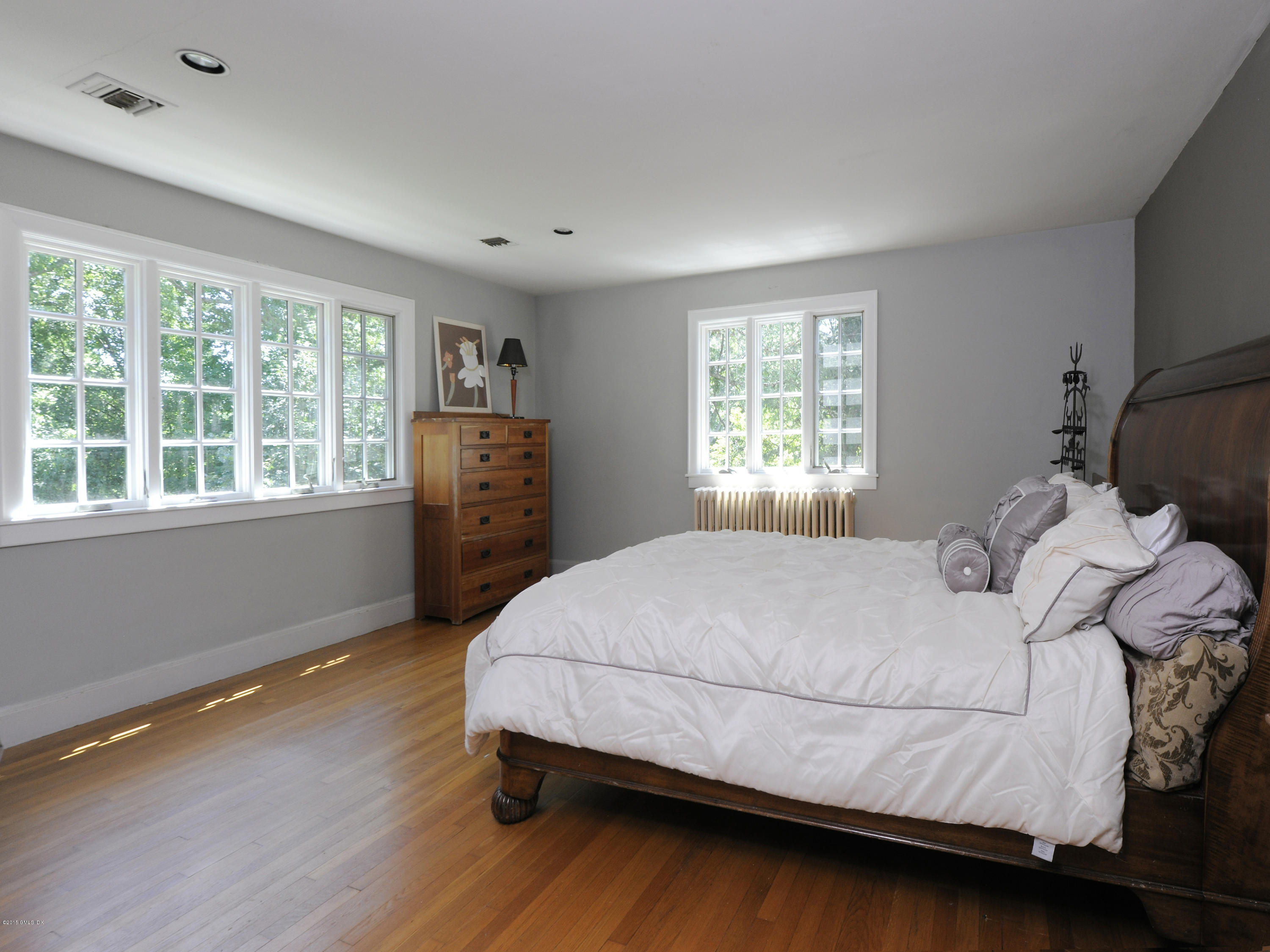 65 Overlook Drive Greenwich, CT 06830 - Photo 13 of 21 a bedroom with a bed and wooden floor