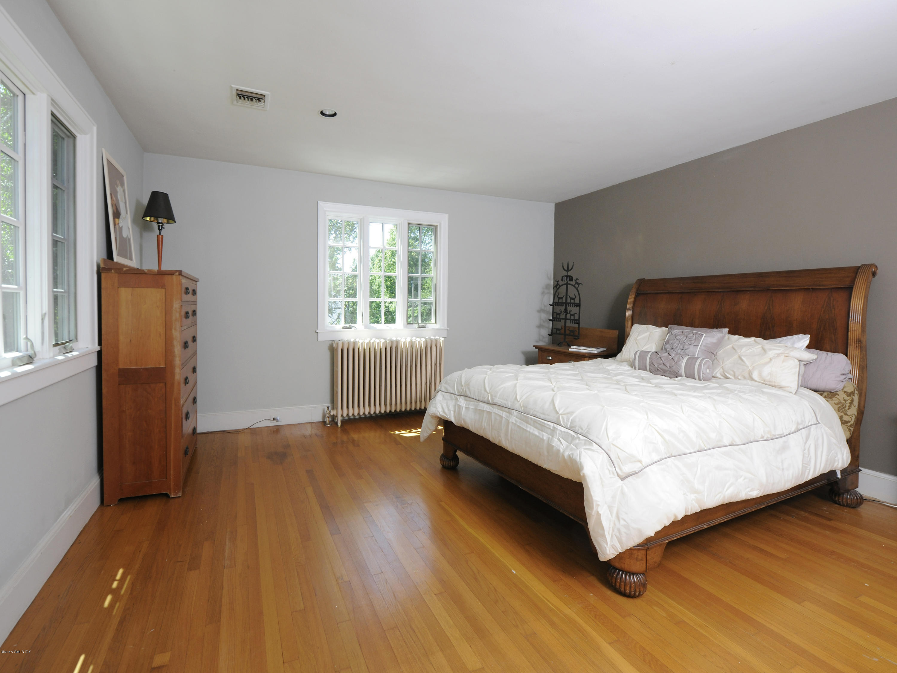 65 Overlook Drive Greenwich, CT 06830 - Photo 14 of 21 a bedroom with a bed and wooden floor