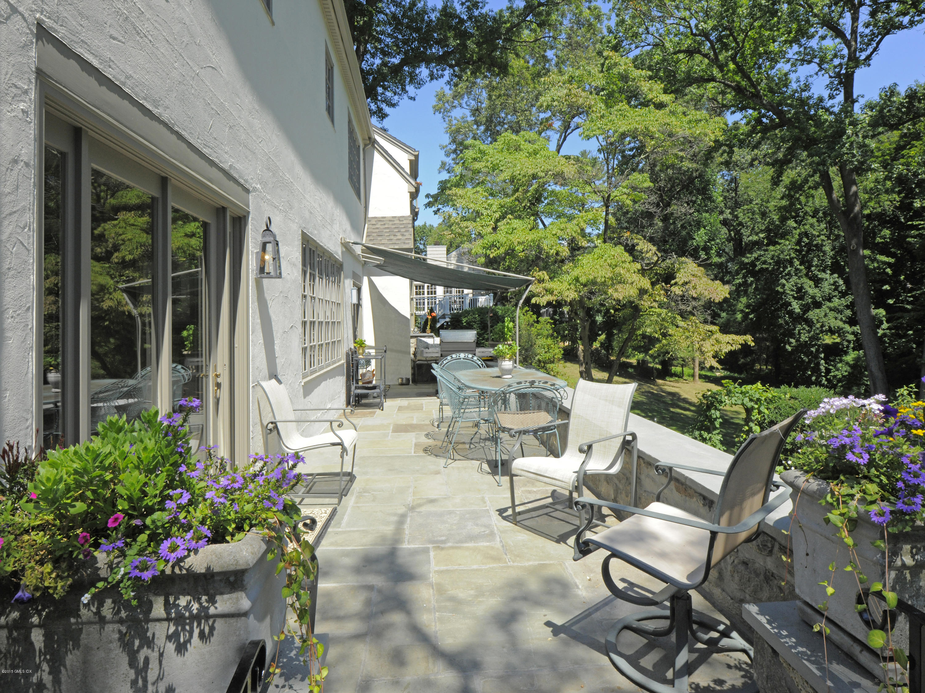 65 Overlook Drive Greenwich, CT 06830 - Photo 16 of 21 a view of a patio with chairs and potted plants