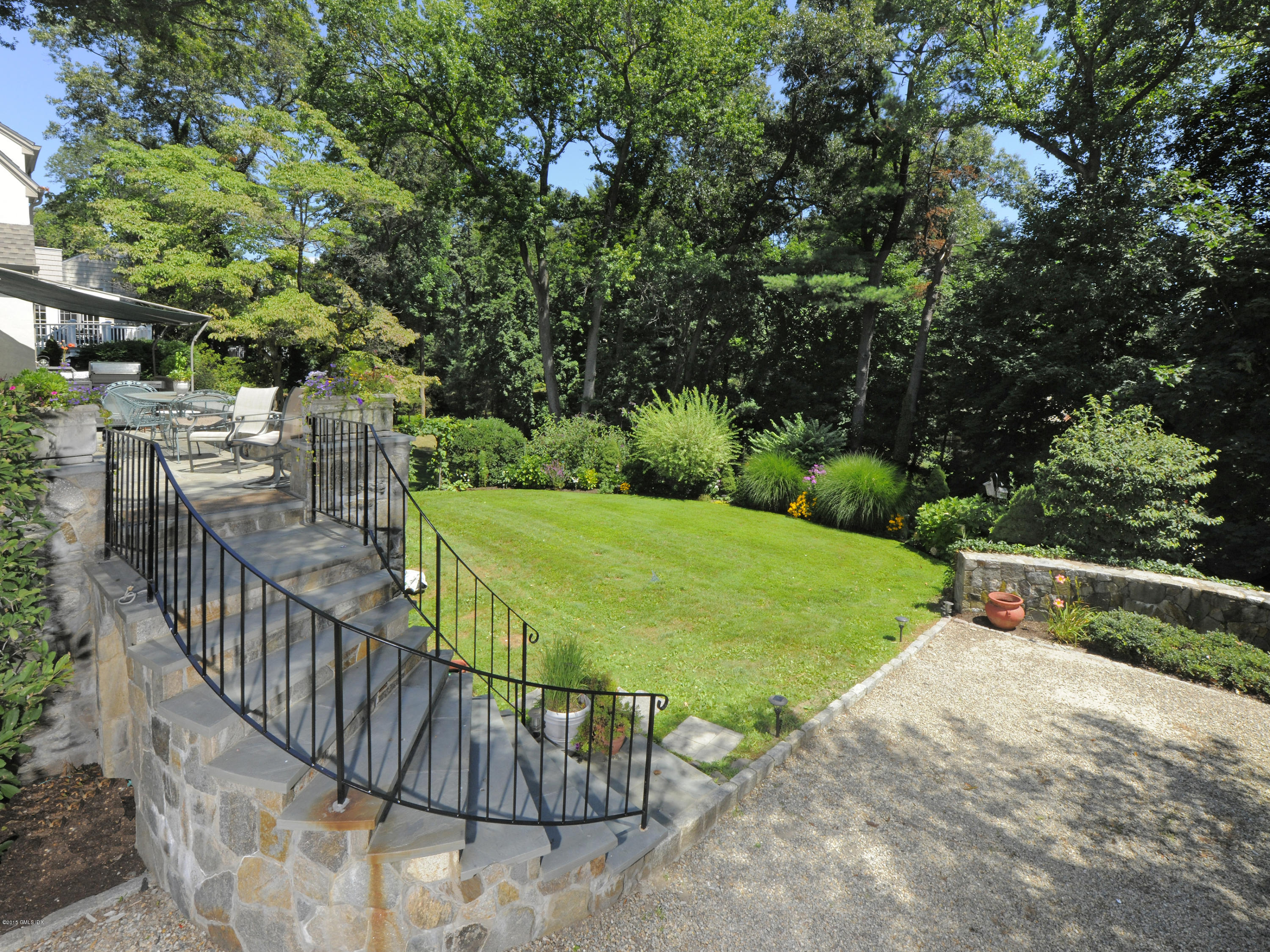 65 Overlook Drive Greenwich, CT 06830 - Photo 17 of 21 a view of a swimming pool with a garden and deck