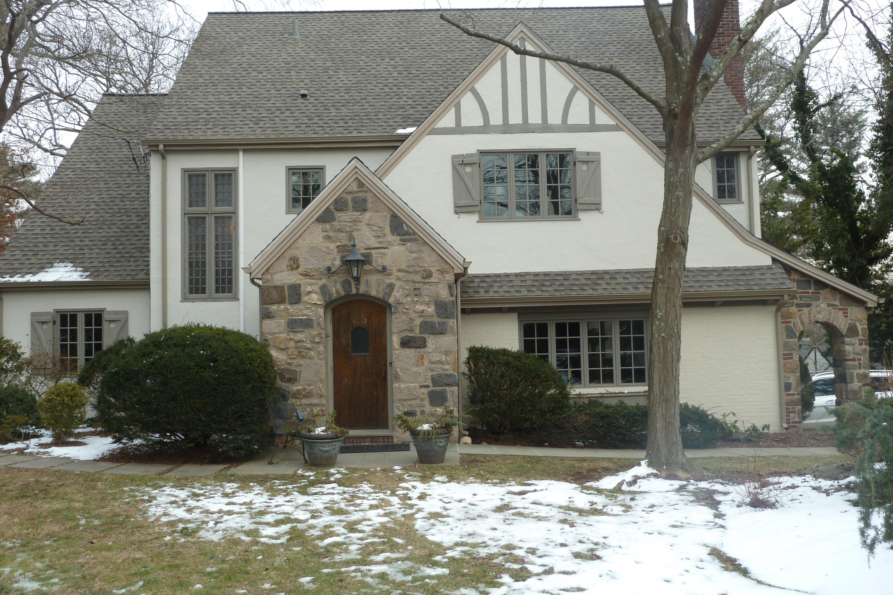 65 Overlook Drive Greenwich, CT 06830 - Photo 2 of 21 a front view of a house with garden