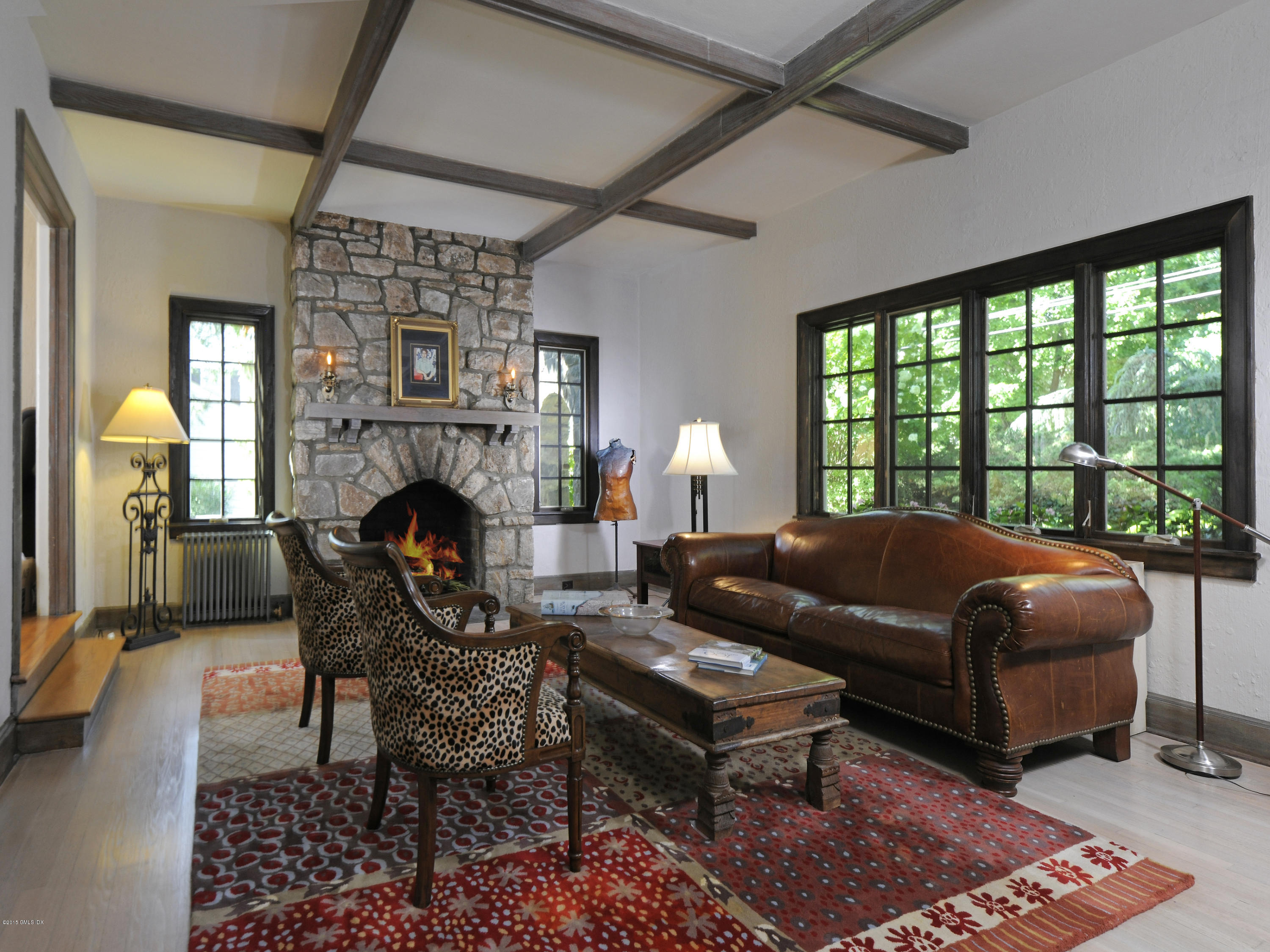 65 Overlook Drive Greenwich, CT 06830 - Photo 6 of 21 a living room with furniture a fireplace and a table