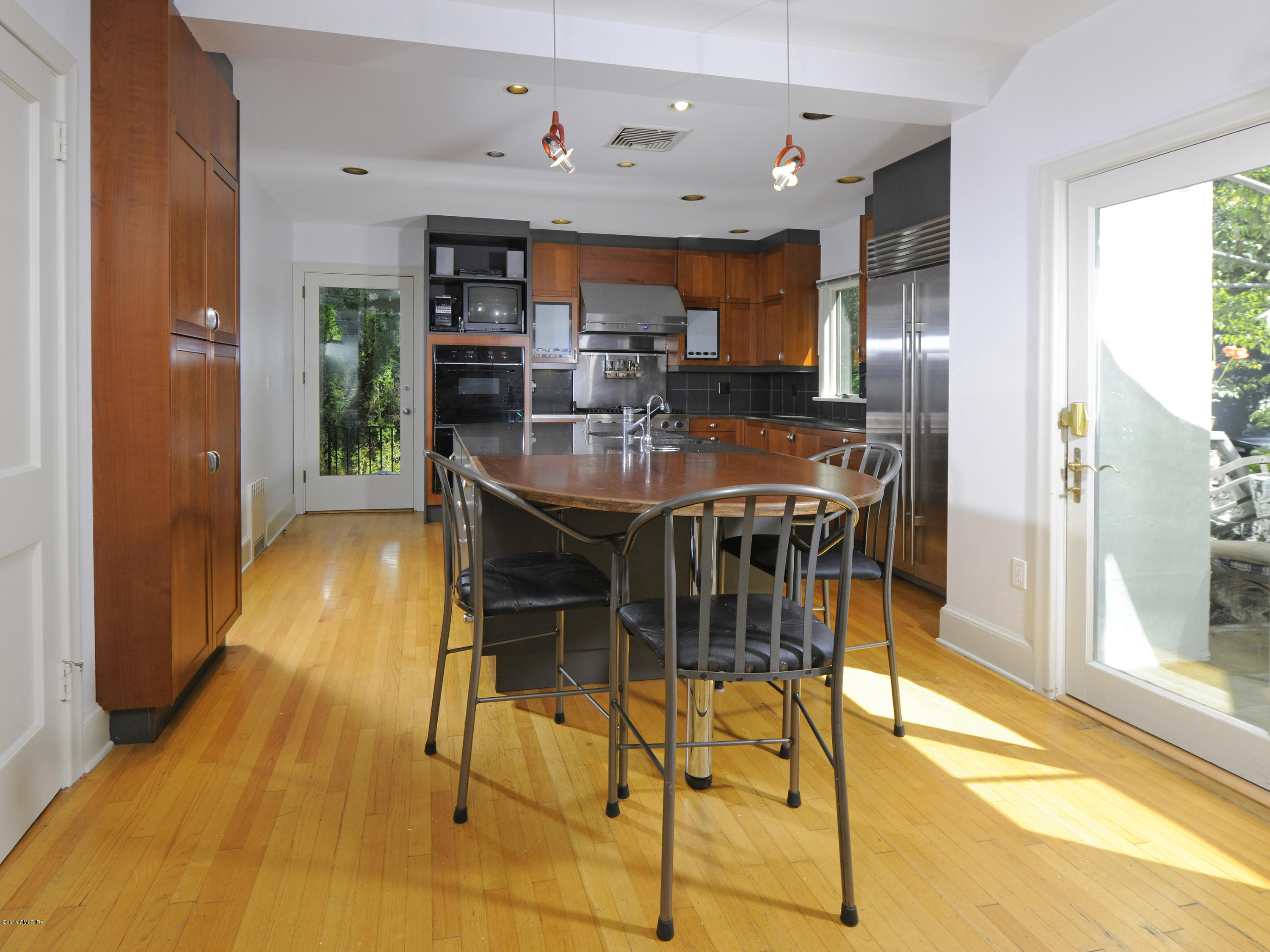 65 Overlook Drive Greenwich, CT 06830 - Photo 10 of 21 a view of a dining room with furniture and a kitchen view