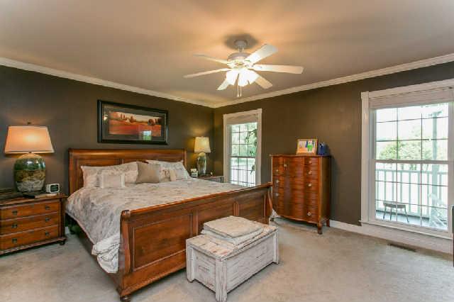 2670 Cooks Road Mount Juliet, TN 37122 - Photo 10 of 20 a bedroom with a bed and a chandelier
