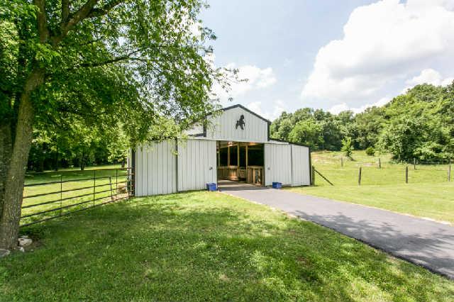 2670 Cooks Road Mount Juliet, TN 37122 - Photo 17 of 20 a view of a house with a yard and large trees