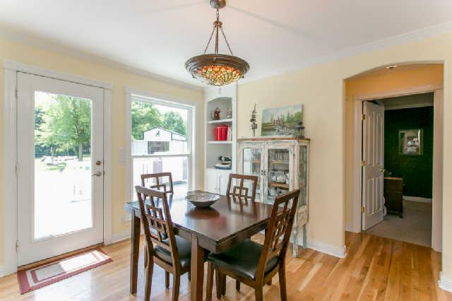 2670 Cooks Road Mount Juliet, TN 37122 - Photo 4 of 20 a dining room with furniture a chandelier and wooden floor