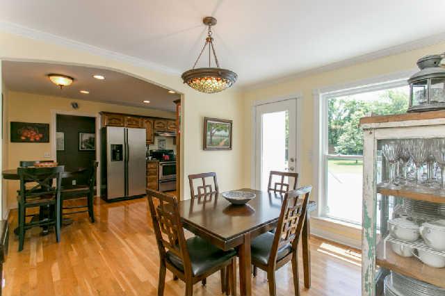 2670 Cooks Road Mount Juliet, TN 37122 - Photo 5 of 20 a dining room with furniture a chandelier and wooden floor