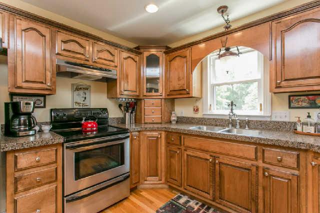 2670 Cooks Road Mount Juliet, TN 37122 - Photo 9 of 20 a kitchen with granite countertop a sink stainless steel appliances and cabinets