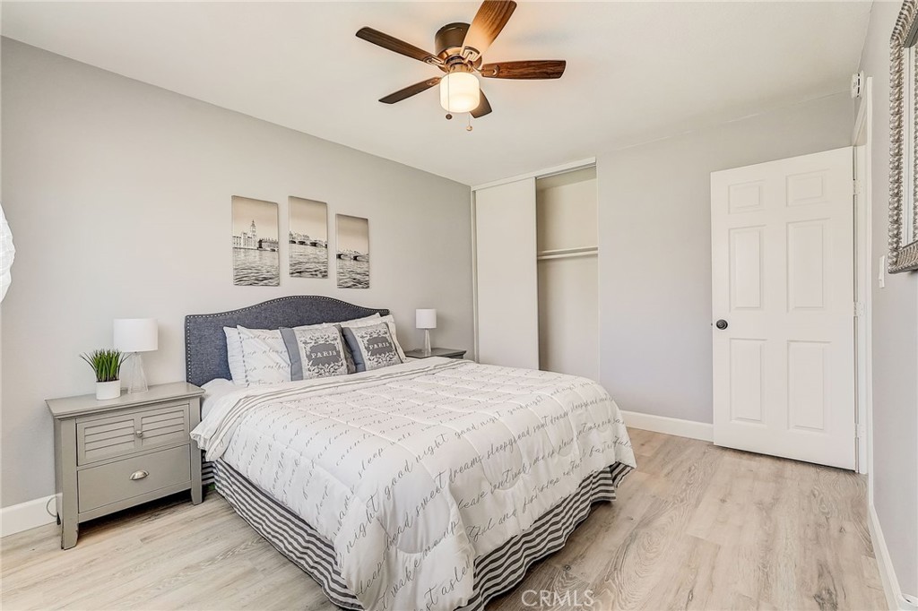 11124 Blue Jay Drive Riverside, CA 92505 - Photo 7 of 16 a bedroom with a bed and a chandelier