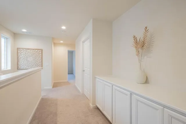 a bedroom with a bed and a ceiling fan