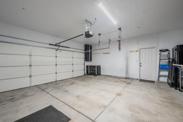 a kitchen with refrigerator and cabinets