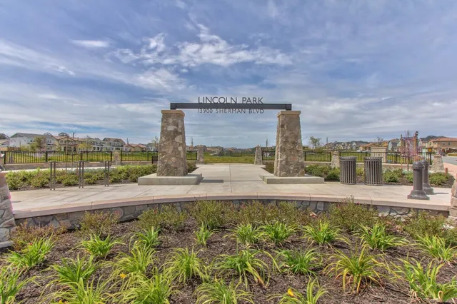 a view of a street with a pole on the roadside