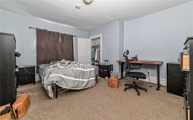 a white toilet sitting next to a bathroom sink