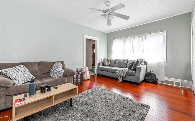 a living room with furniture and a rug