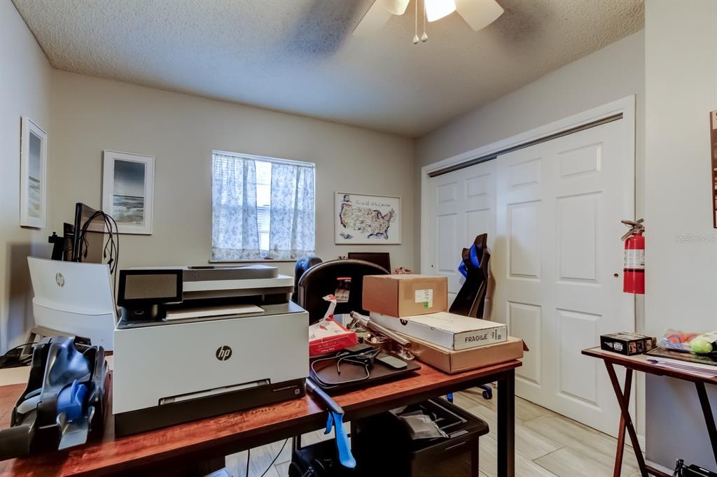 39748 Meadowood Loop Zephyrhills, FL 33542 - Photo 16 of 40 a view of a workspace with furniture and a window