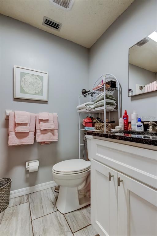 39748 Meadowood Loop Zephyrhills, FL 33542 - Photo 17 of 40 a bathroom with a toilet and a sink